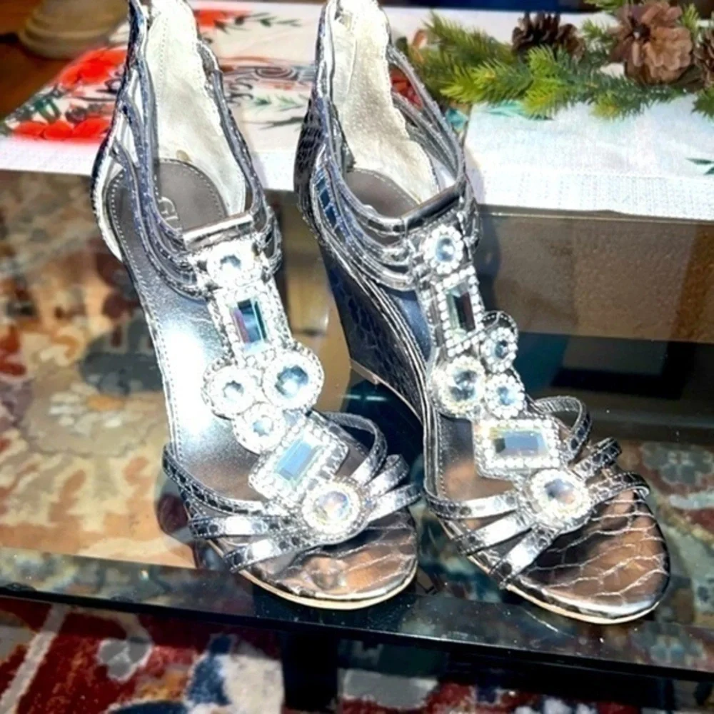 Guess heels about to 4inches, big rhinestones , bright and shiny